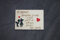 Personalized wooden love message plaque with engraved text, heart accents, and silhouette design