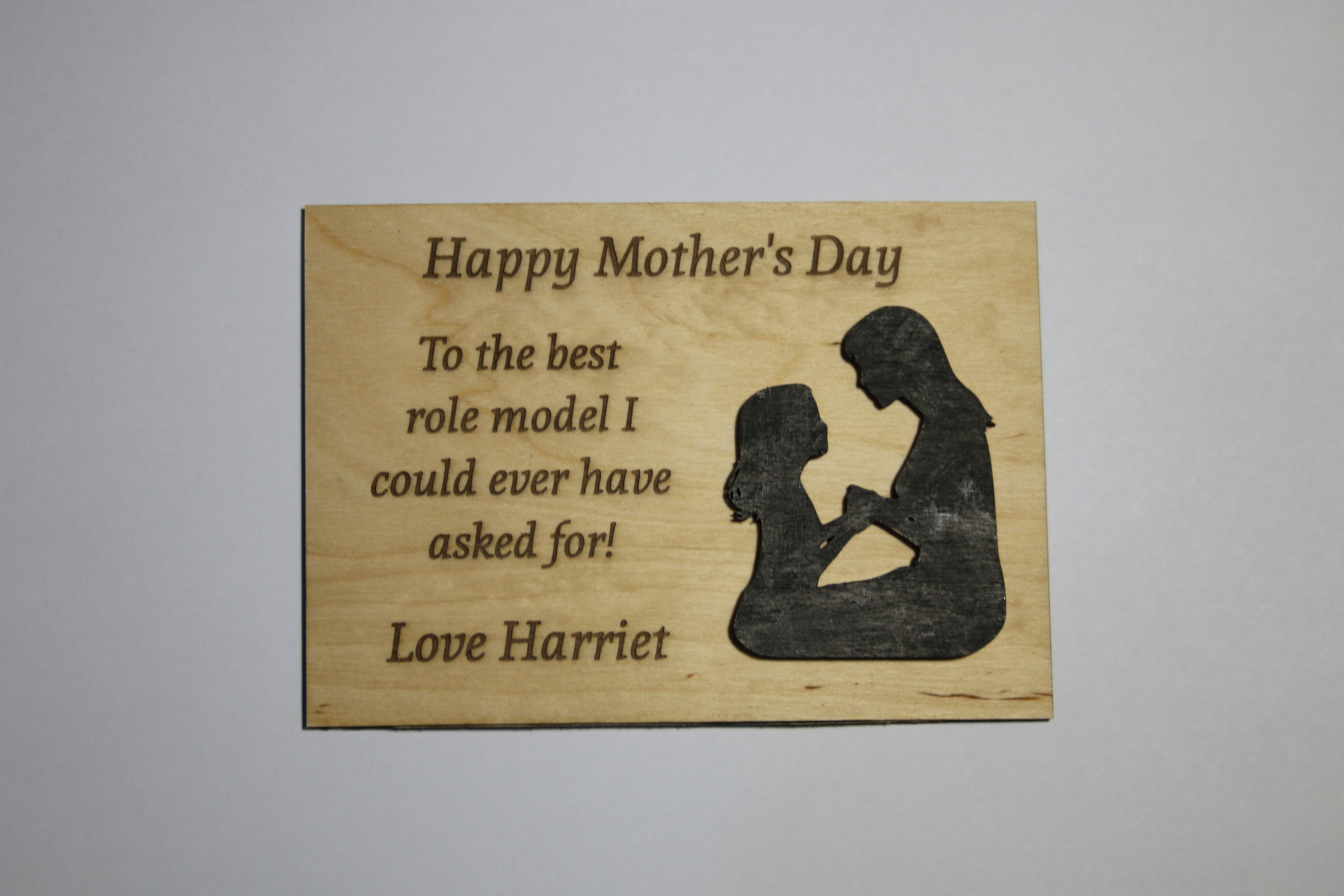 Plywood Mother's Day plaque with an embossed figure of a mother and child and engraved heartfelt message