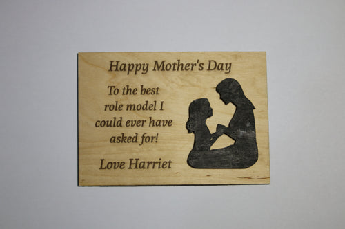 Plywood Mother's Day plaque with an embossed figure of a mother and child and engraved heartfelt message