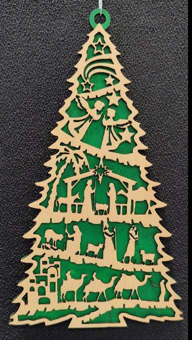 Laser cut plywood Christmas tree ornament with nativity scene and green background